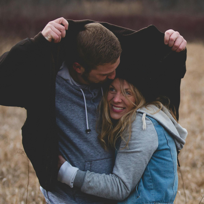 A couple enjoying a cuddly moment